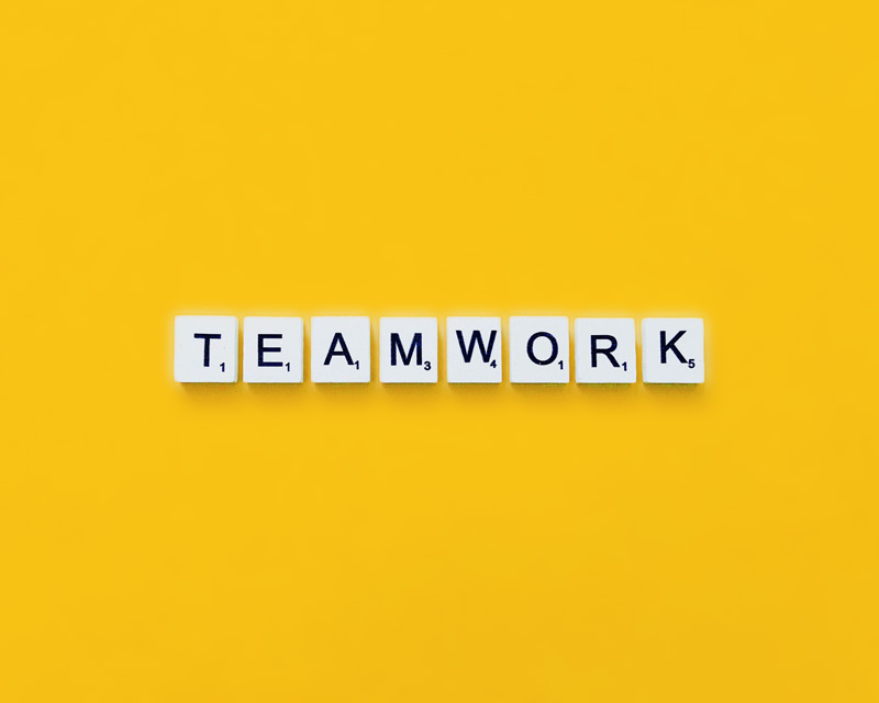 Scrabble letters spell out the word teamwork